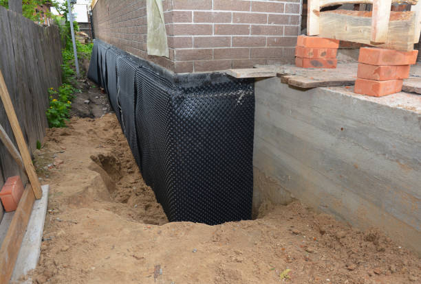 Happy homeowners after waterproofing job in Dunlap